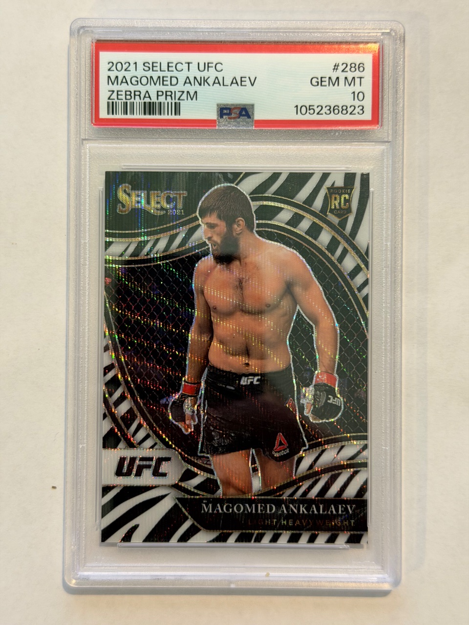 Magomed Ankalaev RC 2021 Select UFC Octagonside Zebra Prizm #286 — 2021 · 2021 Panini Select UFC · Magomed Ankalaev · Octagonside Zebra Prizm · PSA 10