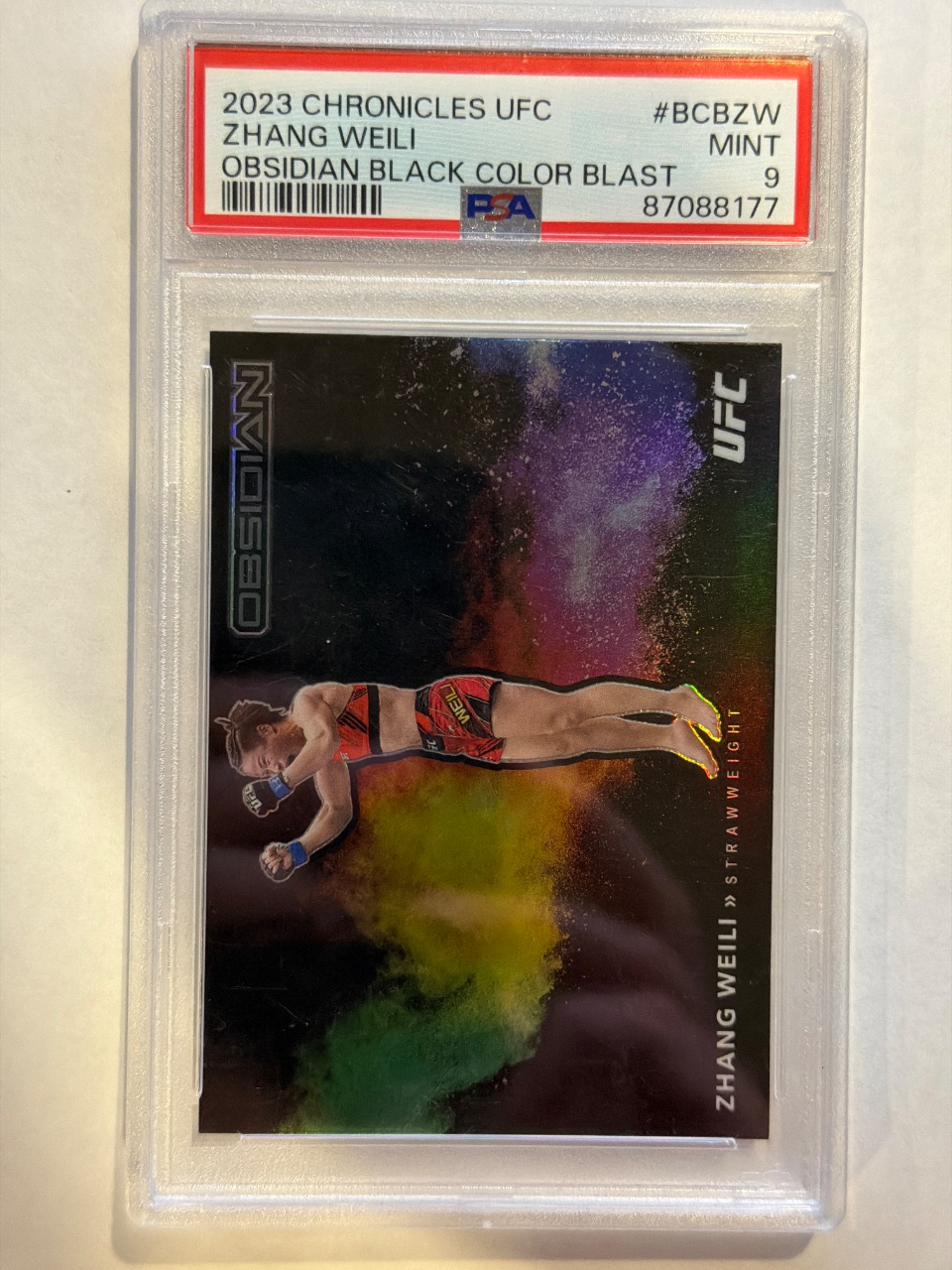 Zhang Weili 2023 Panini Chronicles UFC Obsidian Black Color Blast Base #BCB-ZW — 2023 · 2023 Panini Chronicles UFC · Zhang Weili · Obsidian Black Color Blast · PSA 9