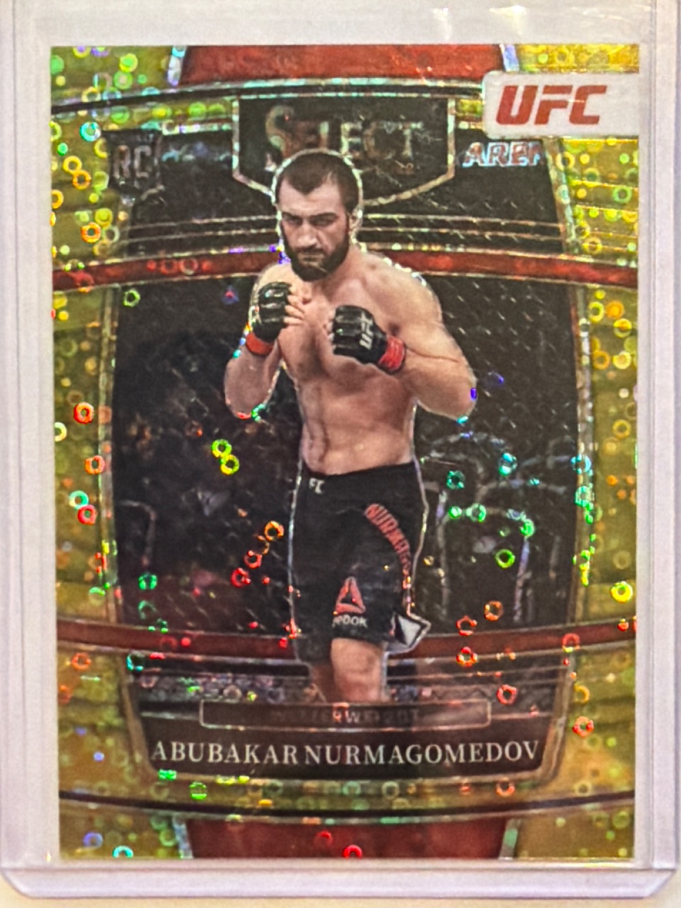 ABUBAKAR NURMAGOMEDOV 2022 Panini Select UFC Concourse Gold Disco Prizm /10 #64 — 2022 · 2022 Panini Select UFC · Abubakar Nurmagomedov · Concourse Gold Disco Prizm · raw